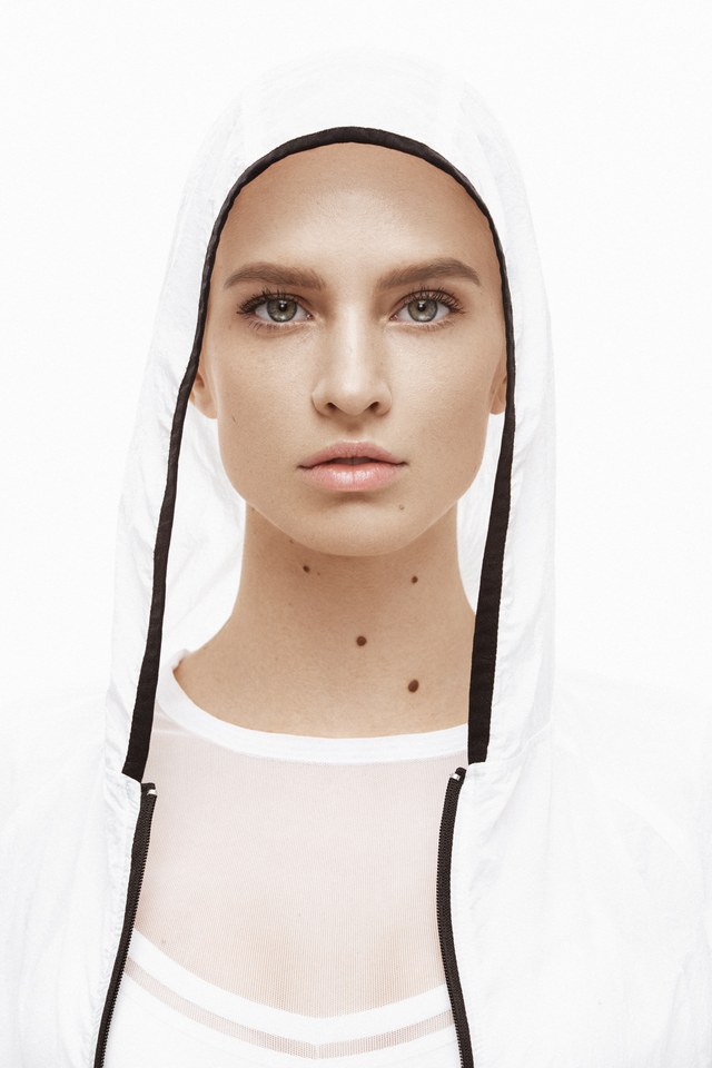 Commercial: clean sculpted skin framed by a white hood